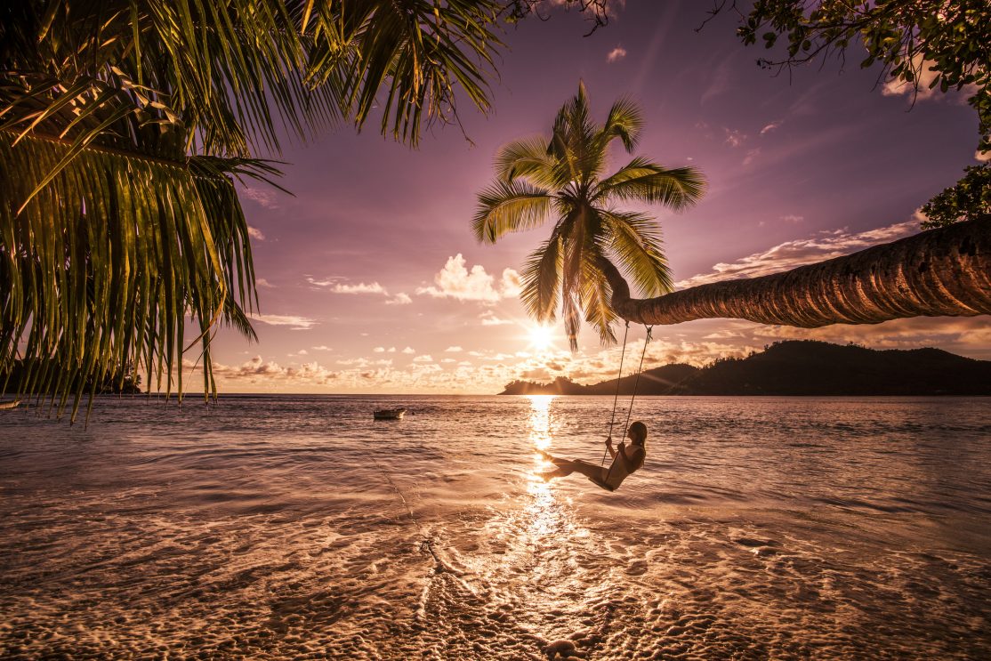 The Seychelles beach with sunset.