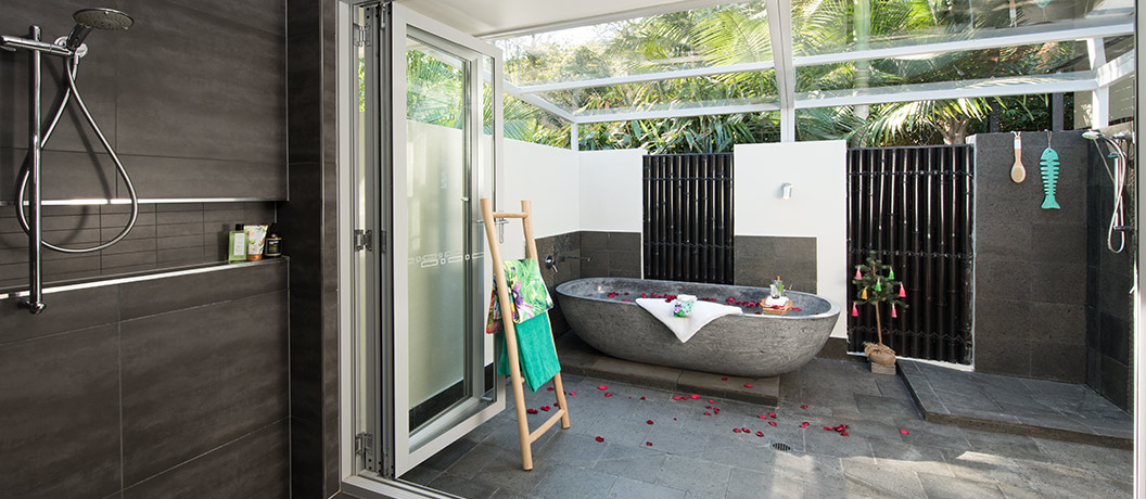 Master bedroom with 'outdoor' bath & shower area.
