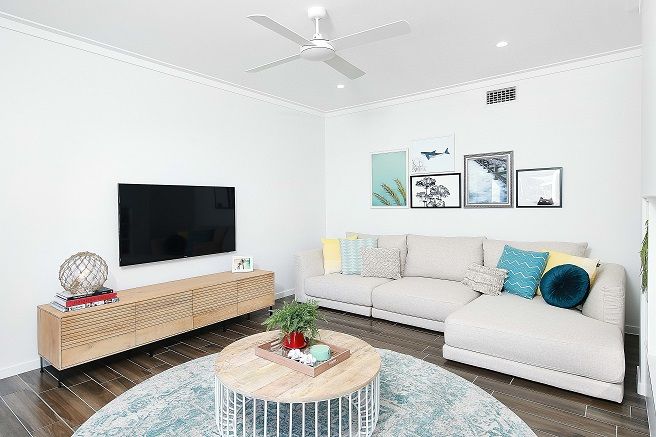Living area with TV and ceiling fan