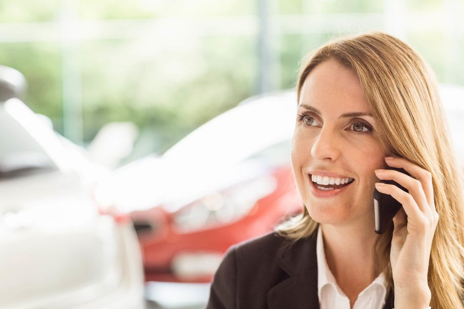 Photodune 13807652 Smiling Saleswoman Having a Phone Call at New Car Showroom S