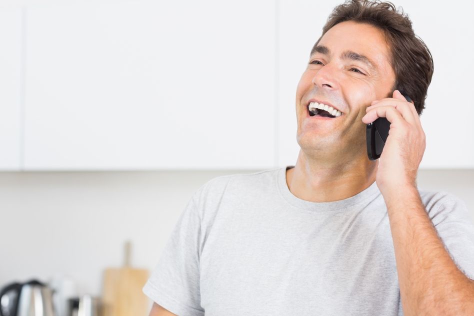 Photodune 8450333 Man in Kitchen Laughing on the Phone S