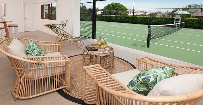 Lounge area looking onto tennis court